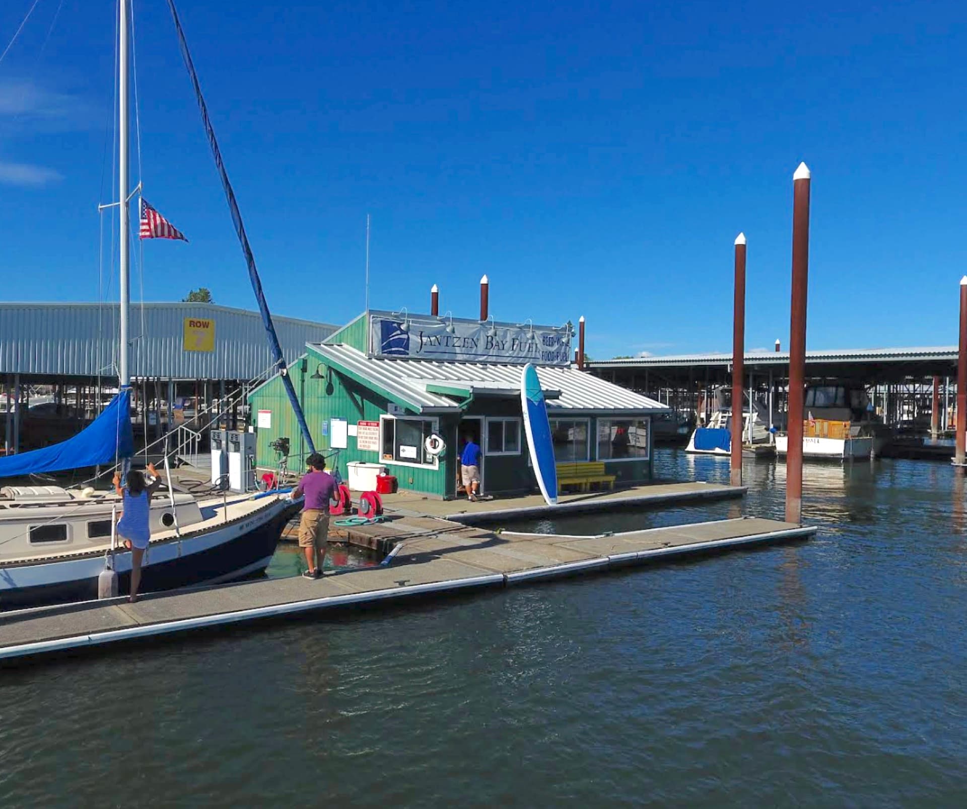 Sailboat fueling up at the Jantzen Fuel Depot dock on the Columbia River, Hayden Island, Portland